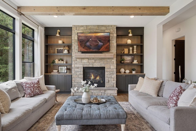 11278 Eastwood Ave SE, Delano, MN 55328 - living room with wood finished floors, beam ceiling, a fireplace, built in features, and recessed lighting