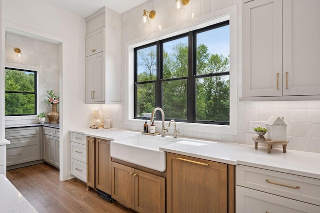 11278 Eastwood Ave SE, Delano, MN 55328 - kitchen with tasteful backsplash and wood finished floors