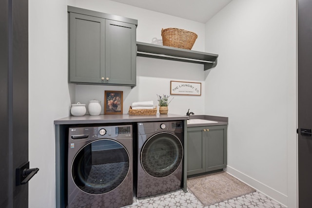 11278 Eastwood Ave SE, Delano, MN 55328 - laundry area featuring cabinet space, washing machine and clothes dryer, and light floors