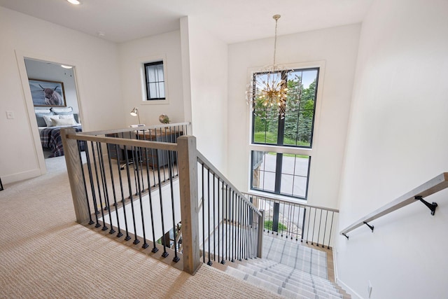 11278 Eastwood Ave SE, Delano, MN 55328 - staircase with a chandelier, healthy amount of natural light, and carpet