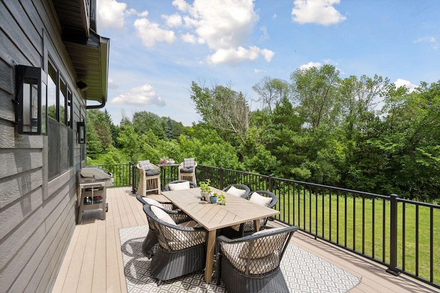 11278 Eastwood Ave SE, Delano, MN 55328 - wooden deck with outdoor dining area, a lawn, and area for grilling