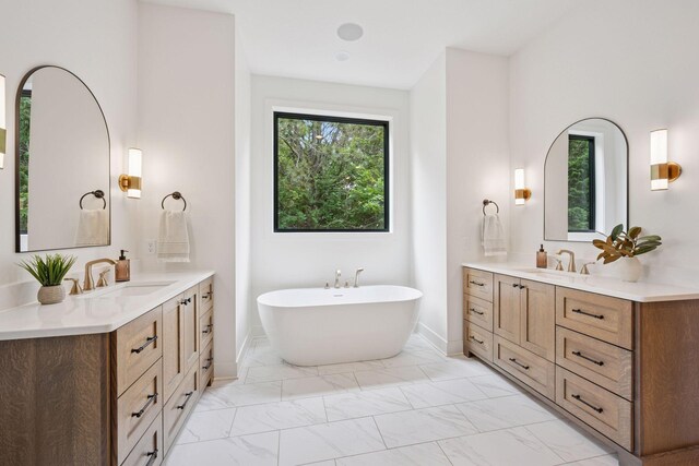 11278 Eastwood Ave SE, Delano, MN 55328 - bathroom with marble finish floors, two vanities, and a soaking tub