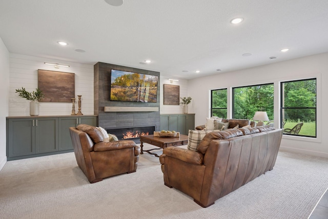 11278 Eastwood Ave SE, Delano, MN 55328 - living room featuring light carpet, a fireplace, and recessed lighting