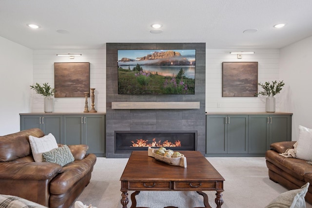 11278 Eastwood Ave SE, Delano, MN 55328 - living room with light colored carpet, a fireplace, and recessed lighting