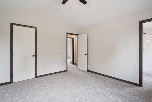 2660 128th Ave NW, Coon Rapids, MN 55434 - unfurnished bedroom featuring vaulted ceiling, carpet floors, baseboards, and ceiling fan