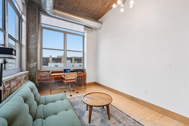 521 7th St Unit 416, Minneapolis, MN 55415 - office featuring wood finished floors, plenty of natural light, and a chandelier