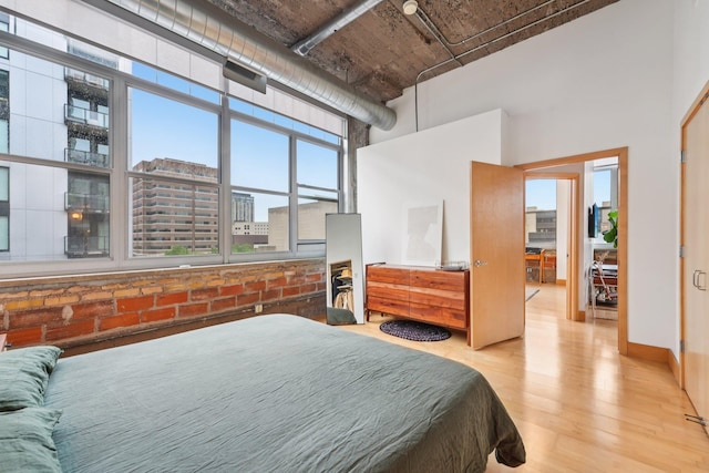 521 7th St Unit 416, Minneapolis, MN 55415 - bedroom with wood finished floors and a high ceiling