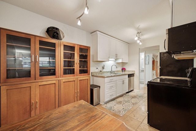 1901 Emerson Ave S Unit 104, Minneapolis, MN 55403 - kitchen with stainless steel dishwasher, white cabinetry, track lighting, freestanding refrigerator, and glass insert cabinets