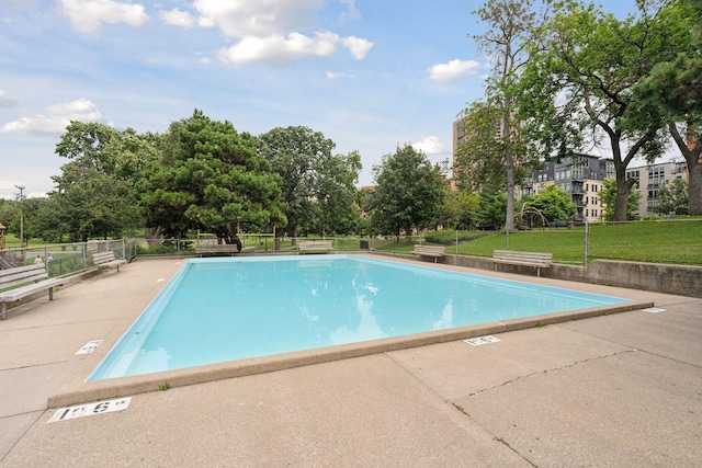 1901 Emerson Ave S Unit 104, Minneapolis, MN 55403 - community pool with view of wooded area and a patio