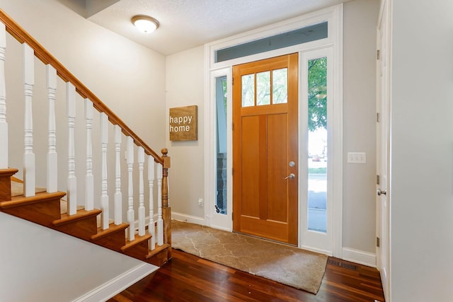 448 3rd St, Excelsior, MN 55331 - entryway featuring dark wood-style flooring and stairs