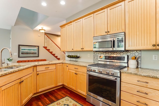 448 3rd St, Excelsior, MN 55331 - kitchen featuring stainless steel appliances, light brown cabinetry, dark wood-style flooring, recessed lighting, and light stone countertops