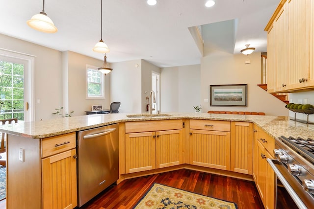 448 3rd St, Excelsior, MN 55331 - kitchen featuring stainless steel appliances, dark wood-style flooring, light stone counters, hanging light fixtures, and recessed lighting