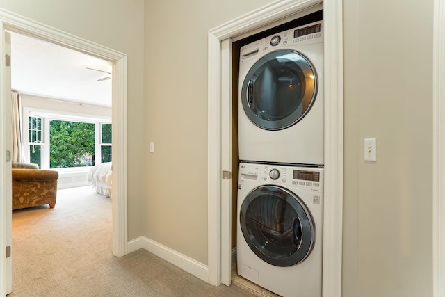448 3rd St, Excelsior, MN 55331 - washroom with stacked washing machine and dryer and light colored carpet