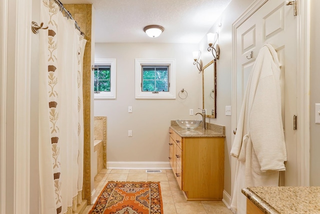 448 3rd St, Excelsior, MN 55331 - bathroom with vanity, tile patterned flooring, and a bathtub