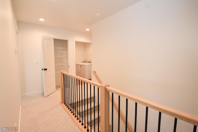 3724 27th St S, Moorhead, MN 56560 - corridor featuring washing machine and dryer, an upstairs landing, recessed lighting, light carpet, and baseboards
