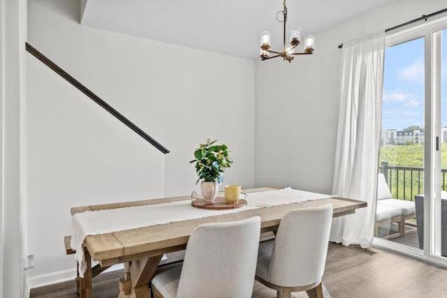 1517 Timberwood Ln, West Saint Paul, MN 55118 - dining space featuring a chandelier, healthy amount of natural light, and wood finished floors
