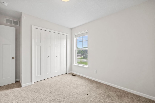1517 Timberwood Ln, West Saint Paul, MN 55118 - unfurnished bedroom with carpet floors and a closet