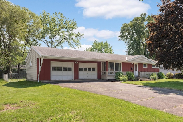 7609 65th Ave N, Brooklyn Park, MN 55428 - single story home featuring a garage, driveway, and board and batten siding