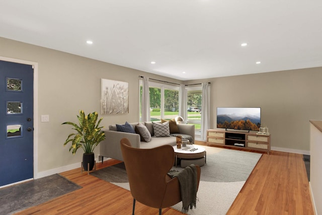 7609 65th Ave N, Brooklyn Park, MN 55428 - living room featuring wood finished floors, baseboards, and recessed lighting