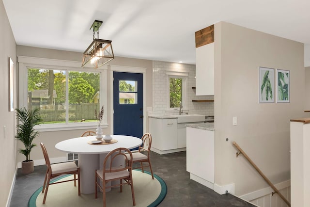 7609 65th Ave N, Brooklyn Park, MN 55428 - dining room with healthy amount of natural light and baseboards