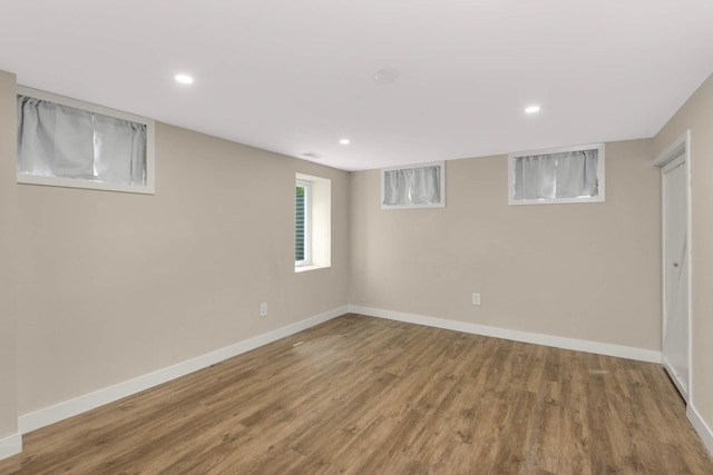 7609 65th Ave N, Brooklyn Park, MN 55428 - below grade area featuring wood finished floors, baseboards, and recessed lighting