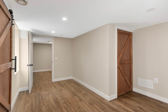 7609 65th Ave N, Brooklyn Park, MN 55428 - spare room with wood finished floors, baseboards, and recessed lighting