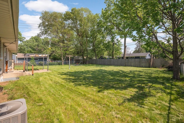 7609 65th Ave N, Brooklyn Park, MN 55428 - view of yard featuring central AC unit