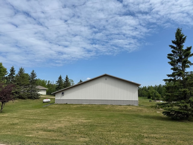 11391 Briski Rd, Balkan Twp, MN 55719 - view of side of home featuring an outbuilding, a yard, and an outdoor structure