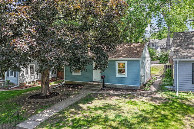 2725 Webster Ave S, Saint Louis Park, MN 55416 - view of front of house featuring a shingled roof and a front yard