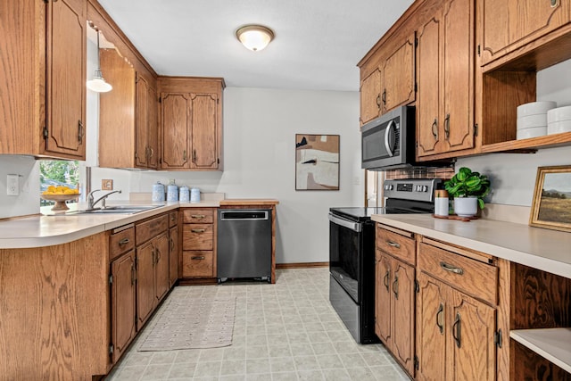 4618 Jefferson St NE, Columbia Heights, MN 55421 - kitchen featuring stainless steel appliances, open shelves, brown cabinetry, and light flooring