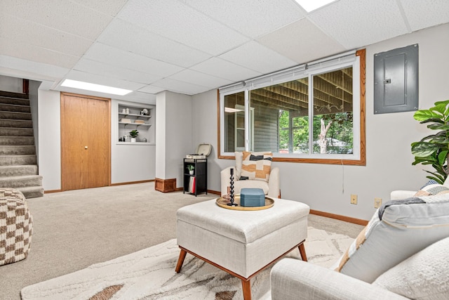 4618 Jefferson St NE, Columbia Heights, MN 55421 - carpeted living area featuring electric panel, stairway, baseboards, and a drop ceiling