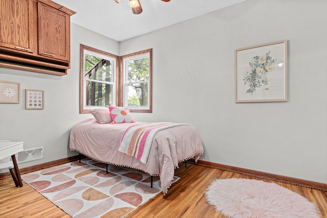 4618 Jefferson St NE, Columbia Heights, MN 55421 - bedroom with light wood-type flooring, baseboards, and a ceiling fan