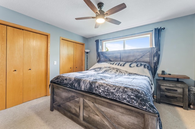 1641 Possum Way, New Richmond, WI 54017 - bedroom with two closets, carpet floors, and a ceiling fan