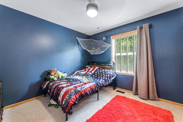 1641 Possum Way, New Richmond, WI 54017 - carpeted bedroom featuring baseboards and a ceiling fan