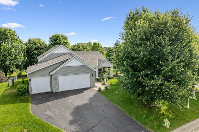 1641 Possum Way, New Richmond, WI 54017 - view of front of house featuring driveway, a garage, and view of scattered trees