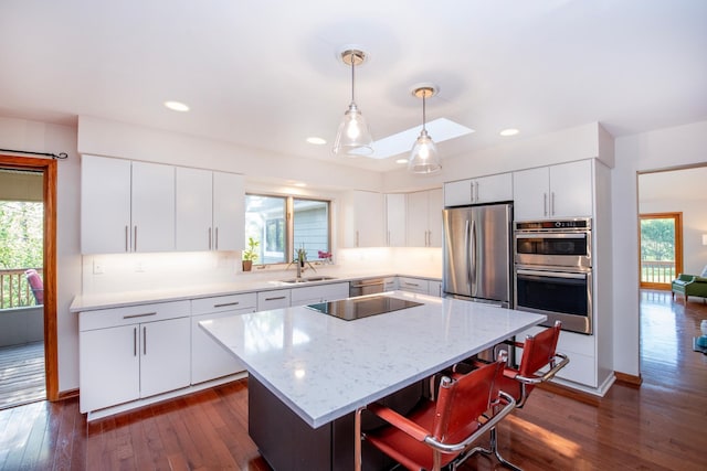 1070 Jefferson Ave, Saint Paul, MN 55105 - kitchen featuring stainless steel appliances, plenty of natural light, a kitchen island, white cabinetry, and recessed lighting