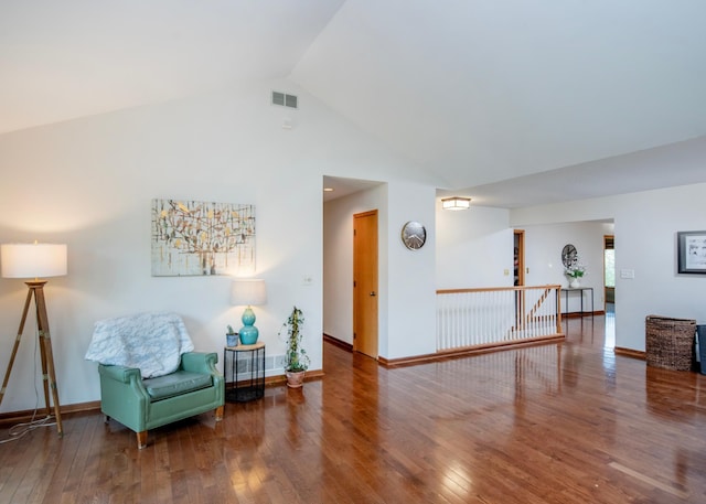 1070 Jefferson Ave, Saint Paul, MN 55105 - sitting room featuring vaulted ceiling, hardwood / wood-style flooring, and an upstairs landing
