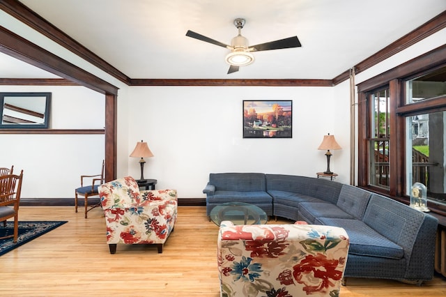 416 6th St, Duluth, MN 55805 - living area with baseboards, wood finished floors, crown molding, and a ceiling fan