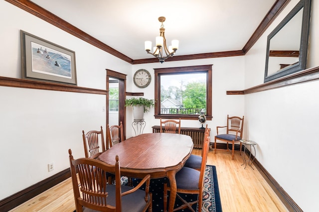 416 6th St, Duluth, MN 55805 - dining area featuring a chandelier, light wood-style flooring, baseboards, and ornamental molding