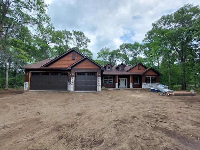 14502 Lynndale Dr, Baxter, MN 56425 - craftsman-style house featuring a garage, driveway, and a porch