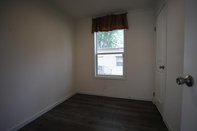 16962 Kenrick Ave Unit 7, Lakeville, MN 55044 - empty room with crown molding, dark wood finished floors, and baseboards
