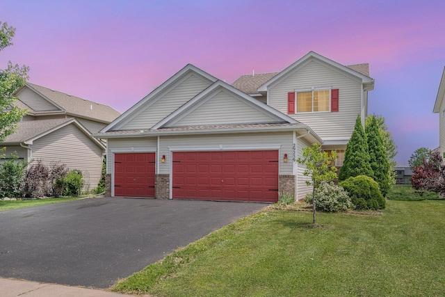 29259 Wildwood Rd, Chisago City, MN 55013 - view of front of property featuring driveway, a garage, and a lawn