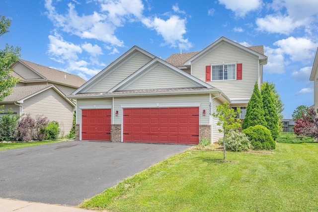 29259 Wildwood Rd, Chisago City, MN 55013 - view of front facade with a garage, a front yard, driveway, and a shingled roof