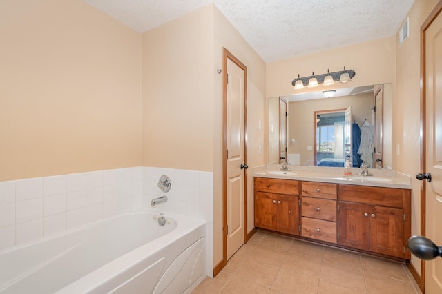 29259 Wildwood Rd, Chisago City, MN 55013 - bathroom with a bath, tile patterned floors, double vanity, and a textured ceiling