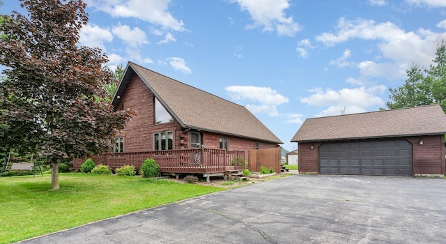 W7340 163rd Ave, Hager City, WI 54014 - view of side of home featuring a garage, an outdoor structure, a lawn, and roof with shingles