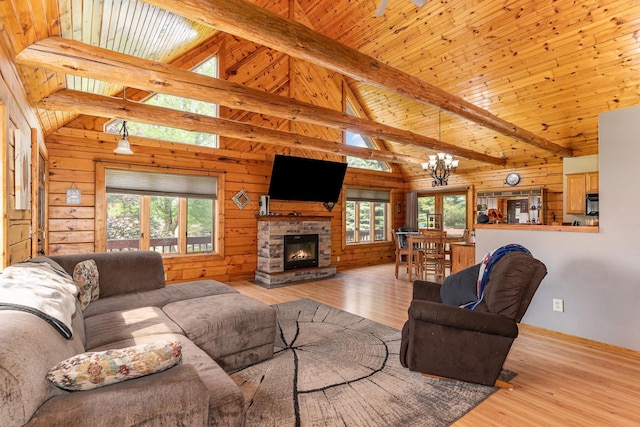 W7340 163rd Ave, Hager City, WI 54014 - living room with wood finished floors, wooden walls, a chandelier, a fireplace, and wooden ceiling