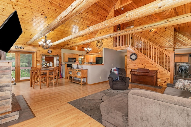 W7340 163rd Ave, Hager City, WI 54014 - living room with a chandelier, a wooden ceiling with exposed beams, high vaulted ceiling, washer and clothes dryer, and wood walls