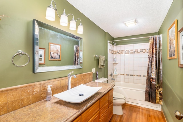 W7340 163rd Ave, Hager City, WI 54014 - full bathroom featuring vanity, wood finished floors, shower / tub combo, and a textured ceiling