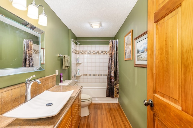 W7340 163rd Ave, Hager City, WI 54014 - full bath featuring vanity, wood finished floors, shower / bathtub combination with curtain, and a textured ceiling