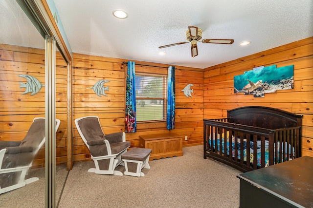 W7340 163rd Ave, Hager City, WI 54014 - carpeted bedroom featuring wooden walls, a textured ceiling, and recessed lighting